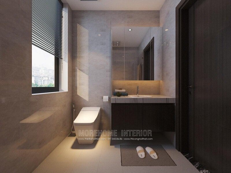Tủ phòng tắm màu trầm kết hợp cùng mặt bàn đá lavabor cùng trang trí hiện đại giúp cho phòng tắm nhỏ trở nên đẹp, sang trọng và đầy tiện ghi.